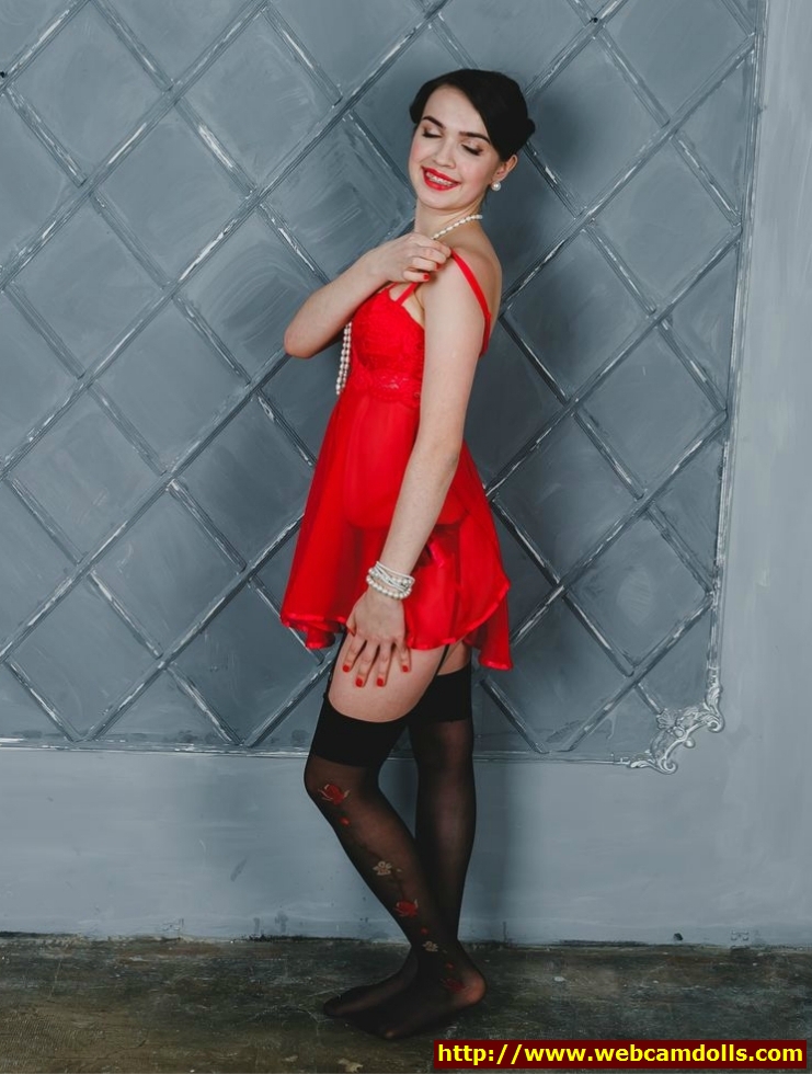 Brunette Girl in Red See-Through Slip and Black Patterned Stockings on Webcamdolls